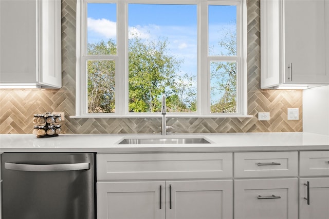 kitchen featuring sink, white cabinetry, and dishwasher