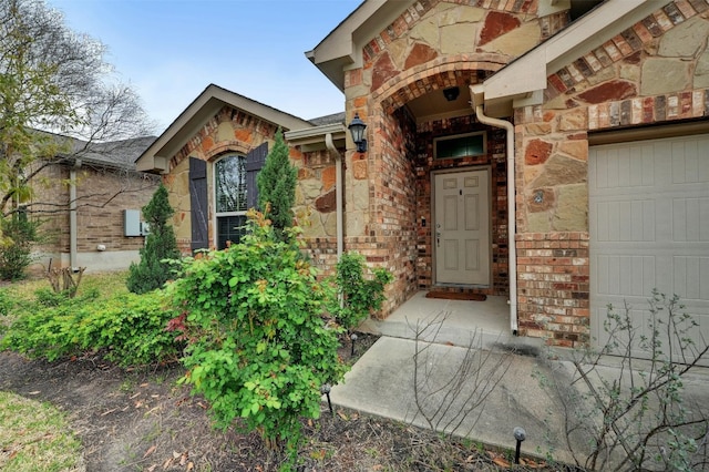 entrance to property featuring a garage