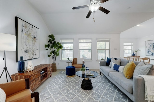 living room with crown molding, lofted ceiling, and ceiling fan