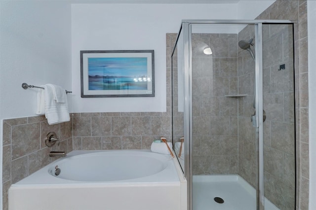 bathroom with separate shower and tub