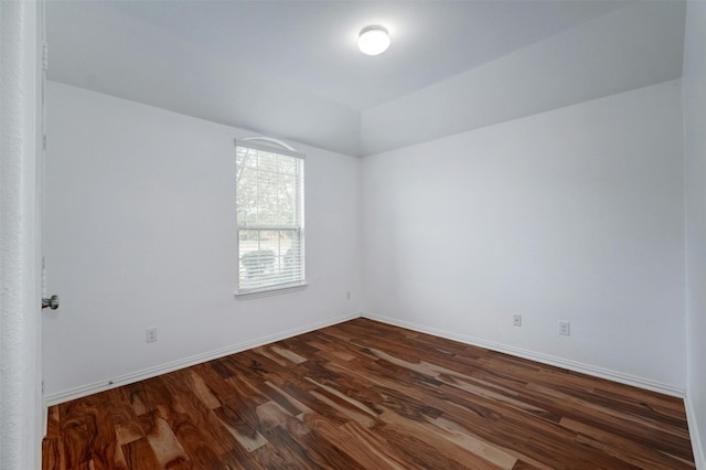 empty room featuring dark hardwood / wood-style floors