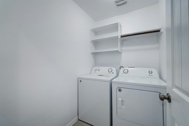 washroom with separate washer and dryer