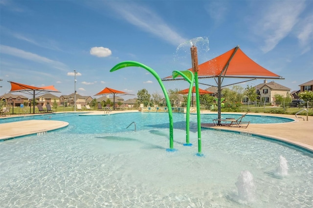 view of swimming pool featuring pool water feature