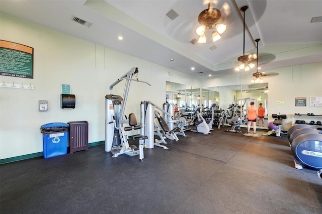 workout area featuring ceiling fan and vaulted ceiling