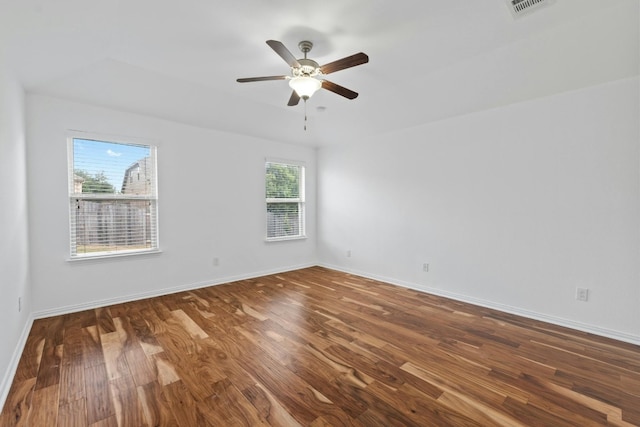 unfurnished room with ceiling fan and dark hardwood / wood-style flooring