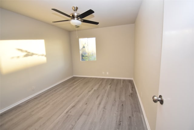 unfurnished room featuring light hardwood / wood-style flooring and ceiling fan