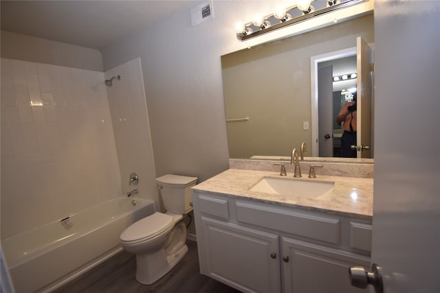 full bathroom featuring toilet, shower / tub combination, hardwood / wood-style flooring, and vanity