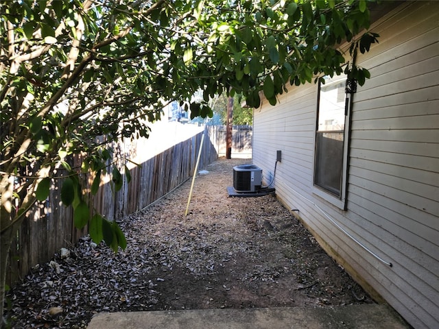 view of yard with central air condition unit