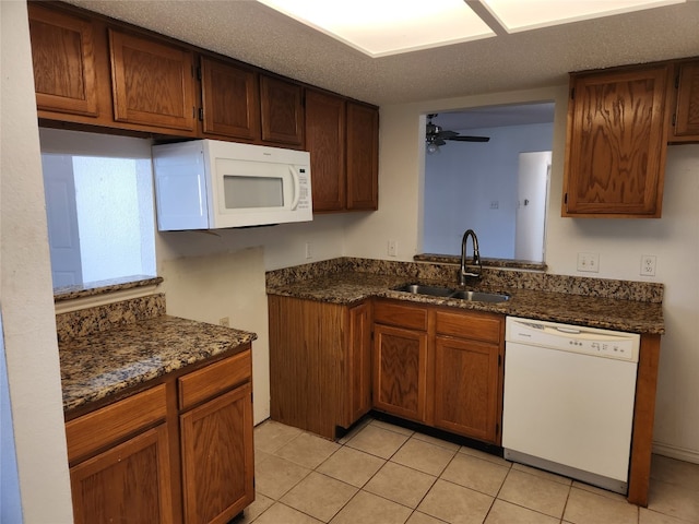 kitchen with white appliances, sink, a textured ceiling, ceiling fan, and light tile patterned floors