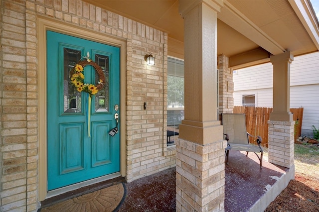 property entrance with covered porch