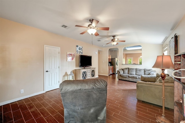 living room featuring dark hardwood / wood-style floors and ceiling fan