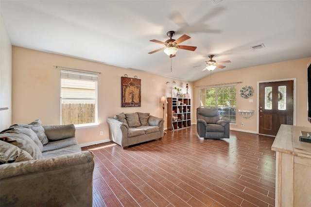 living room featuring lofted ceiling, ceiling fan, and dark hardwood / wood-style flooring