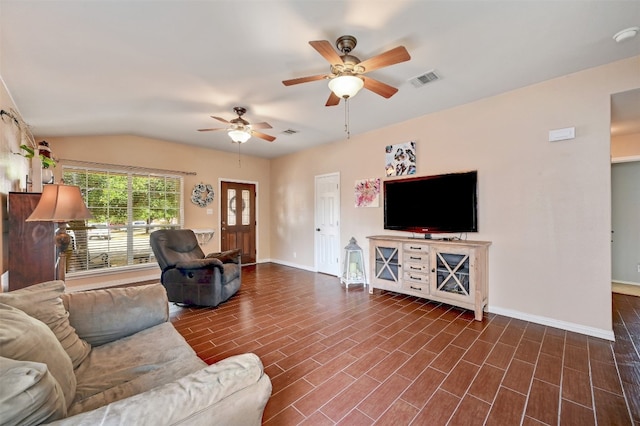 living room with vaulted ceiling, dark hardwood / wood-style floors, and ceiling fan