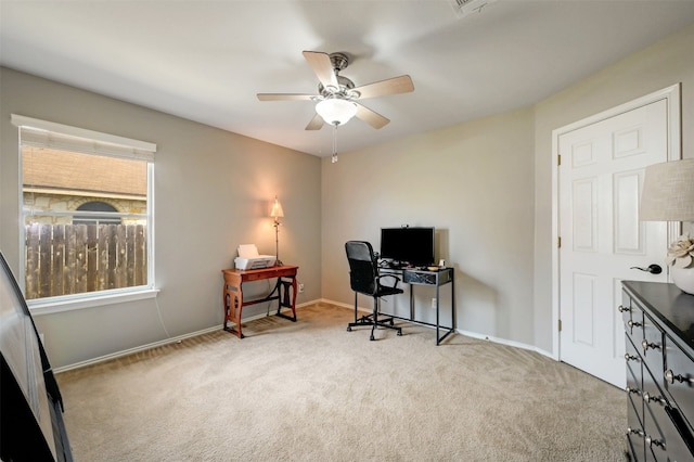 office area with light colored carpet and ceiling fan