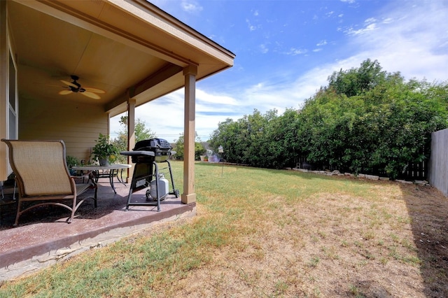 view of yard with a patio and ceiling fan