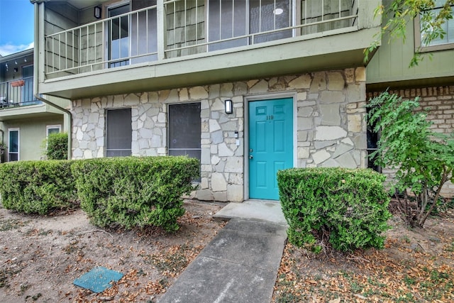 property entrance with a balcony