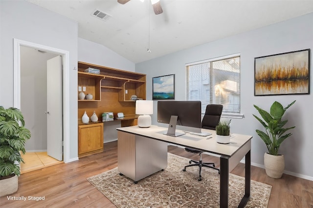 office area featuring light hardwood / wood-style floors, ceiling fan, and vaulted ceiling