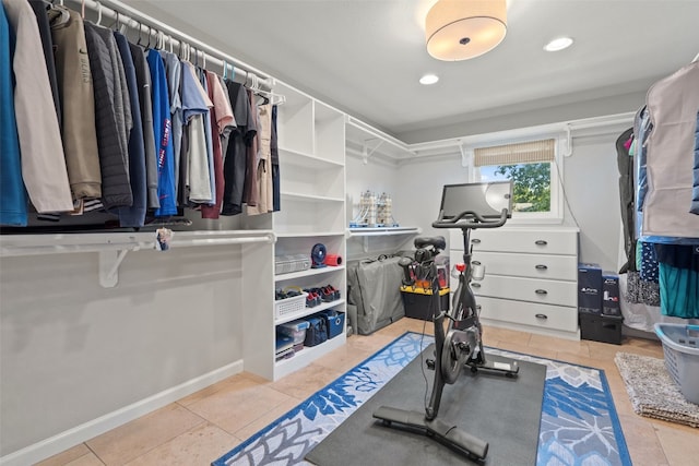 walk in closet featuring light tile patterned flooring