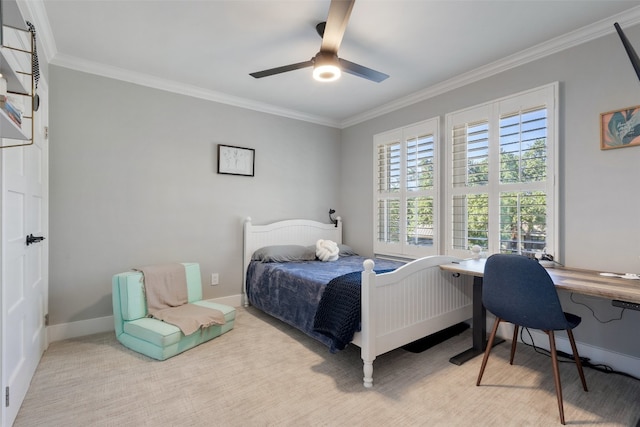 carpeted bedroom featuring crown molding and ceiling fan