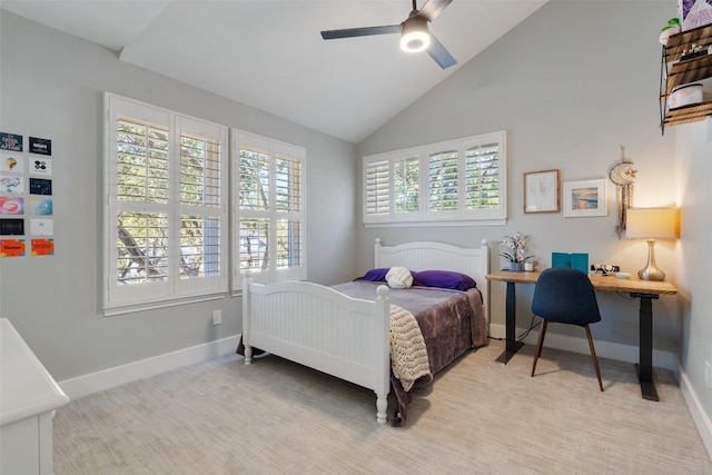 bedroom with light carpet, multiple windows, high vaulted ceiling, and ceiling fan