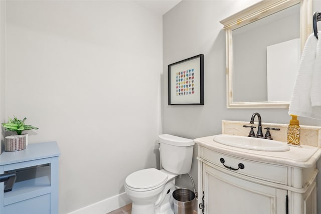 bathroom with vanity, toilet, and tile patterned floors