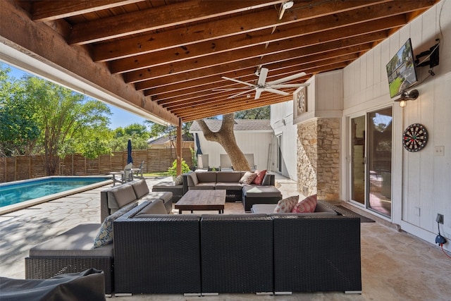 view of patio with ceiling fan, a fenced in pool, and an outdoor hangout area