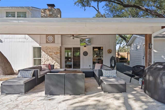 view of patio / terrace with an outdoor living space, grilling area, and ceiling fan