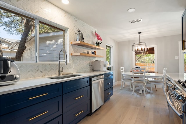 kitchen with light hardwood / wood-style flooring, appliances with stainless steel finishes, sink, and plenty of natural light