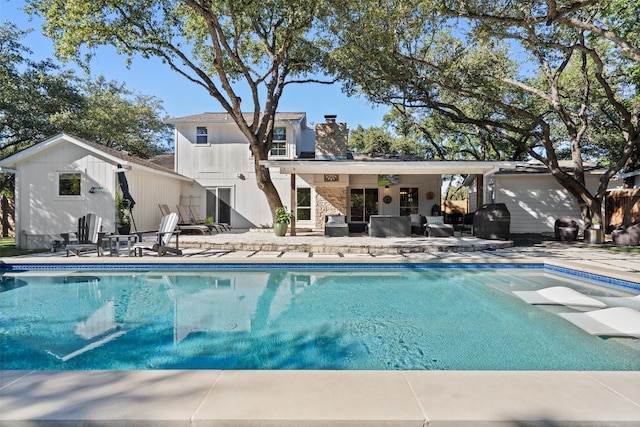 rear view of property with a patio area