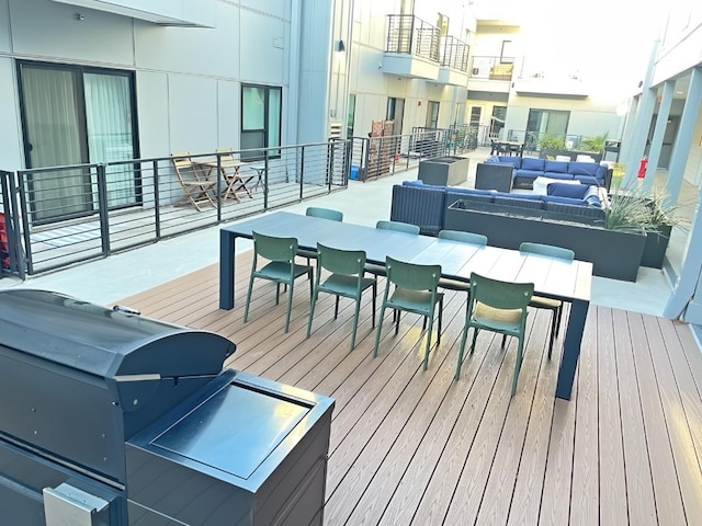 wooden deck featuring outdoor lounge area