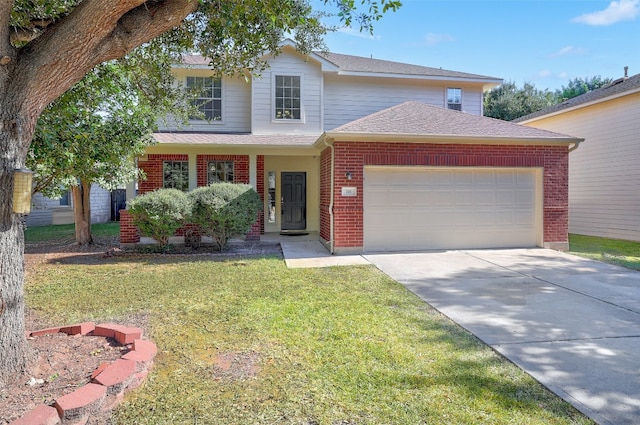 view of front of property featuring a front lawn and a garage