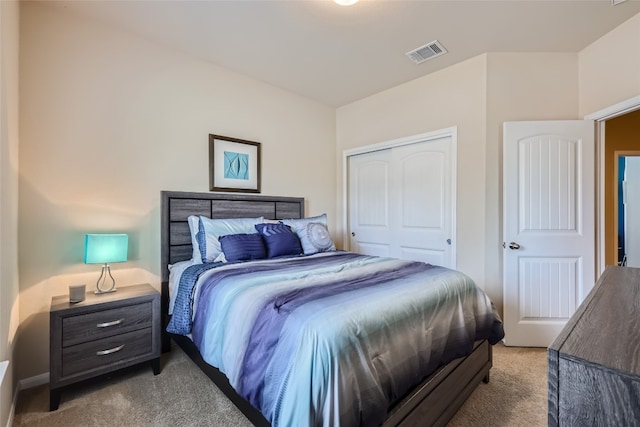 carpeted bedroom with a closet