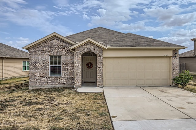 ranch-style house with a front yard and a garage