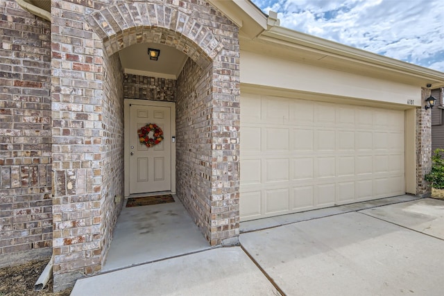 doorway to property featuring a garage