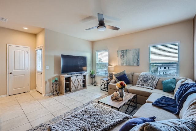 living room featuring ceiling fan and light tile patterned floors