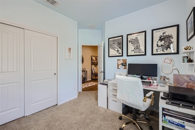 home office featuring light colored carpet