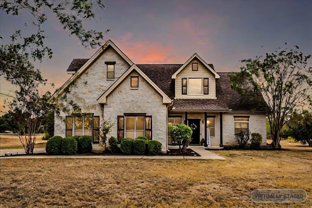 view of front of house featuring a lawn