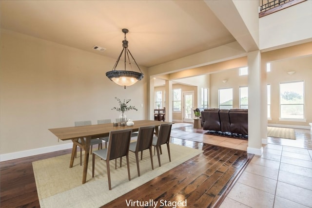 dining space with a healthy amount of sunlight and wood-type flooring