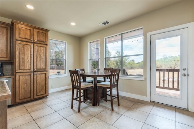 dining space with light tile patterned flooring