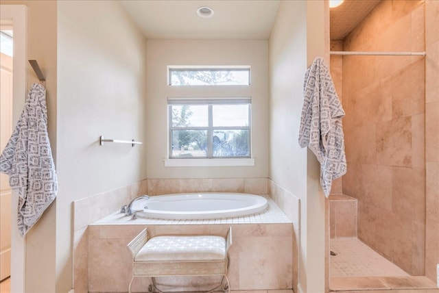 bathroom featuring tile patterned flooring and separate shower and tub