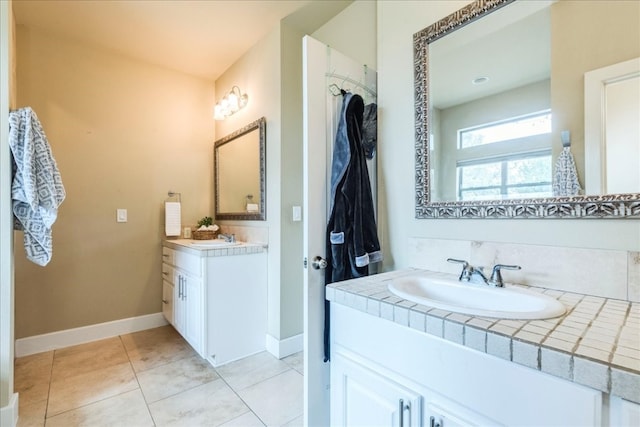 bathroom featuring tile patterned floors and vanity