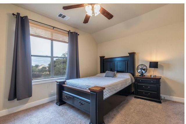 bedroom with ceiling fan, light carpet, and lofted ceiling