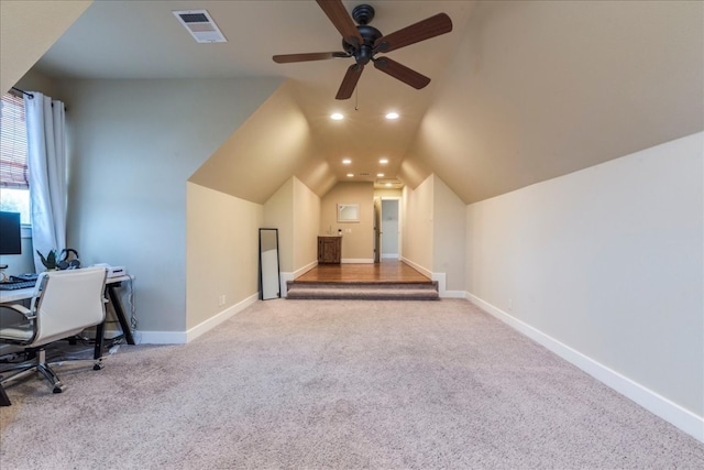 office area with light colored carpet, vaulted ceiling, and ceiling fan