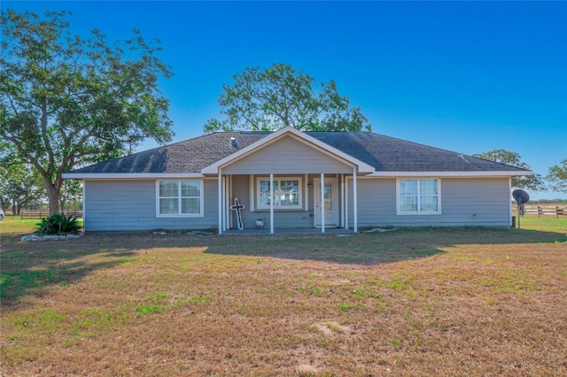 ranch-style house featuring a front lawn