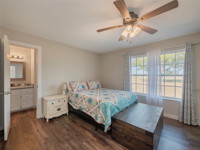 bedroom with dark hardwood / wood-style flooring, ensuite bathroom, and ceiling fan