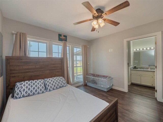 406 Blume Ln, Ledbetter, TX 78946 - bedroom with access to exterior, dark wood-type flooring, ensuite bath, baseboards, and a ceiling fan