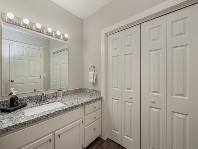 bathroom featuring vanity and hardwood / wood-style flooring