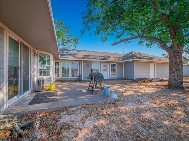 back of property featuring a patio area