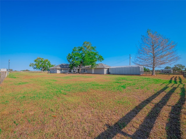 view of yard with a rural view