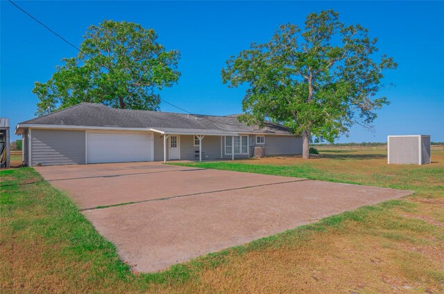 ranch-style home with a porch, a front yard, and a garage